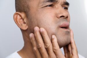 Man with swollen face. 