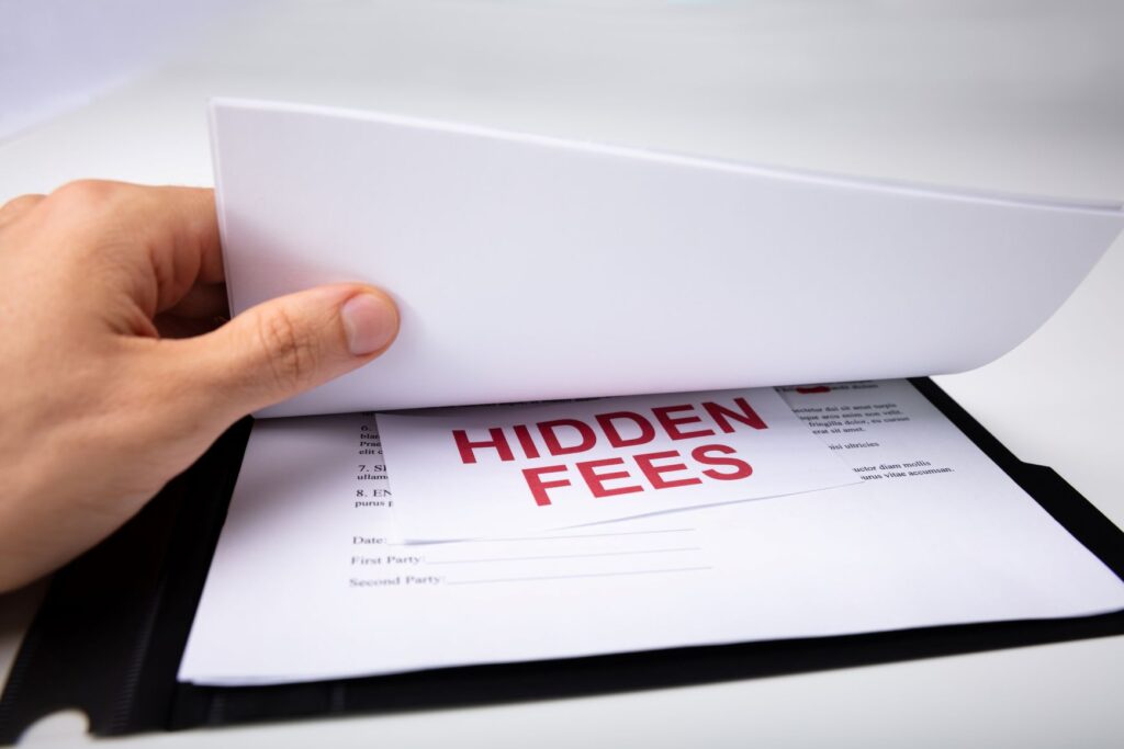 A clipboard with a paper that says hidden fees