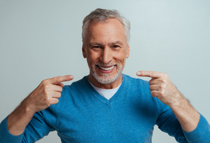 a patient smiling with their dentures